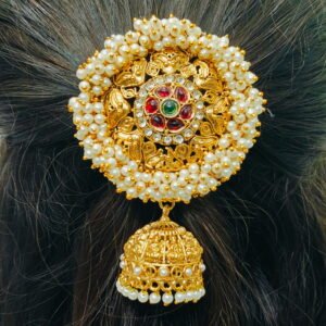 Traditional South Indian gold-finish Jada Billalu hair accessory with pearl detailing and red-green stone embellishments for bridal hairstyles