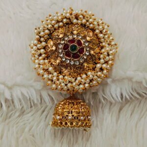 Traditional South Indian gold-finish Jada Billalu hair accessory with pearl detailing and red-green stone embellishments for bridal hairstyles