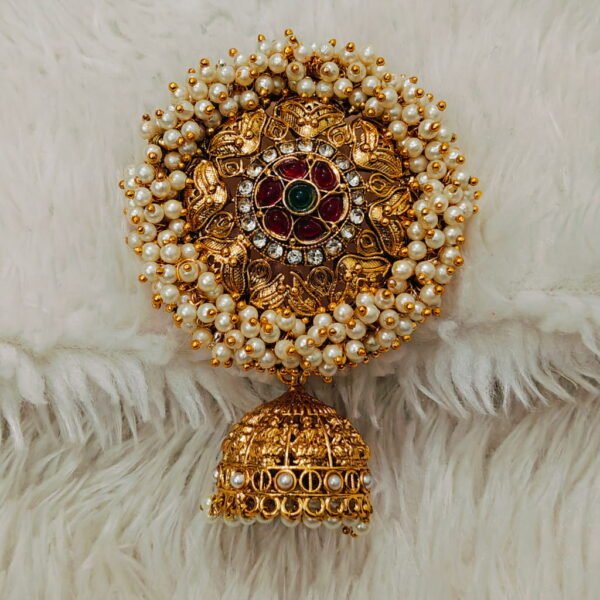 Traditional South Indian gold-finish Jada Billalu hair accessory with pearl detailing and red-green stone embellishments for bridal hairstyles