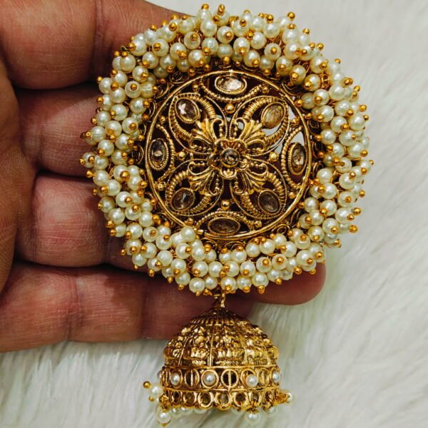 Traditional pearl Jada Billa hair accessory with gold finish and hanging jhumka, used for South Indian bridal braid decoration